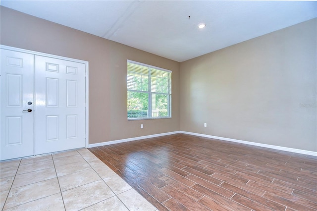 entrance foyer featuring light wood finished floors and baseboards