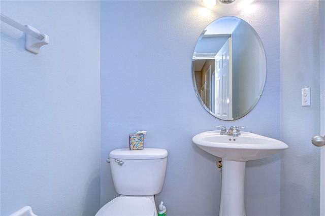 bathroom with a sink and toilet