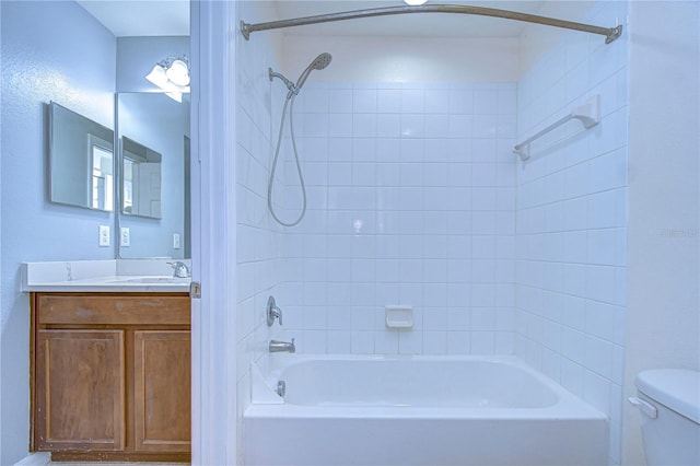 bathroom with shower / bathing tub combination, vanity, and toilet