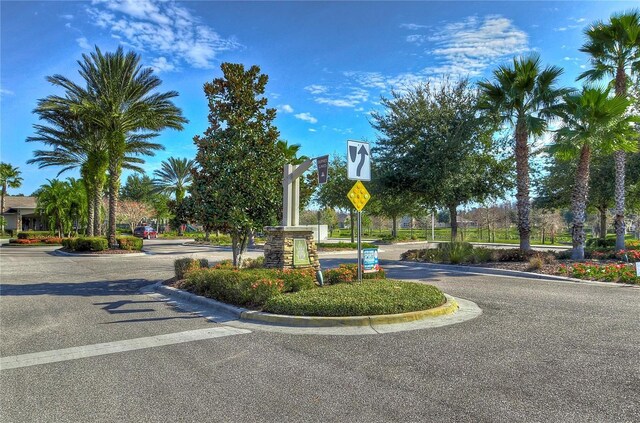 view of street featuring traffic signs and curbs