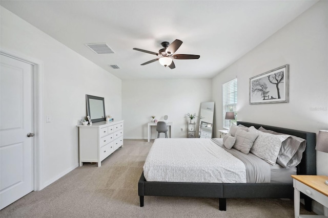 bedroom with ceiling fan and light carpet