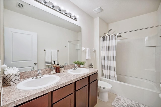 full bathroom featuring toilet, vanity, tile patterned floors, and shower / bath combination with curtain