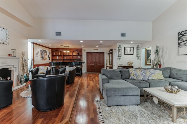 living room featuring hardwood / wood-style floors and indoor bar