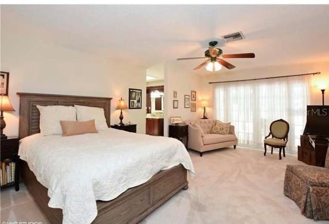 bedroom with ceiling fan and light colored carpet