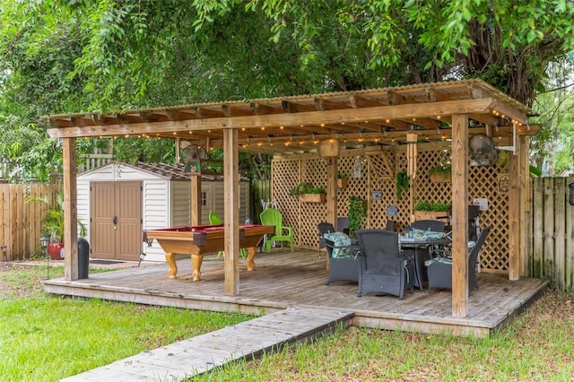 exterior space with a wooden deck and a shed