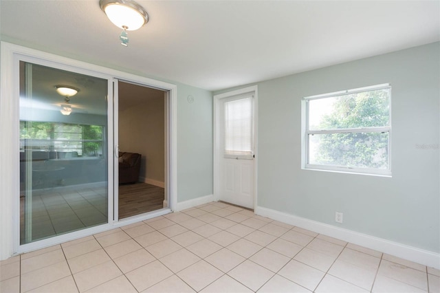 unfurnished bedroom featuring light tile patterned flooring and a closet