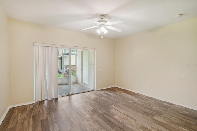 spare room featuring hardwood / wood-style flooring and ceiling fan