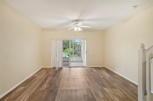 spare room featuring hardwood / wood-style flooring and ceiling fan