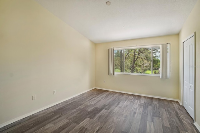 unfurnished bedroom featuring dark hardwood / wood-style floors