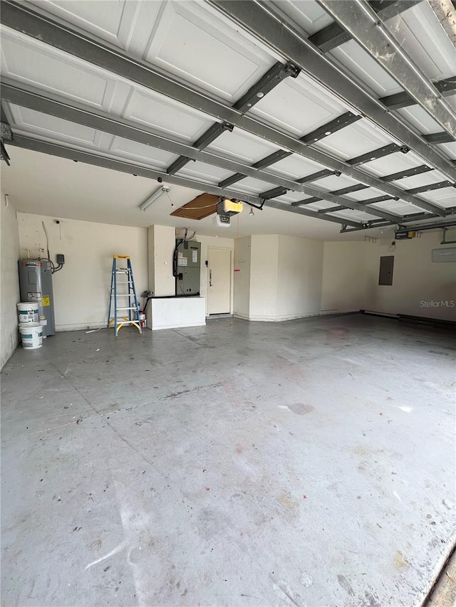 garage featuring electric panel and electric water heater