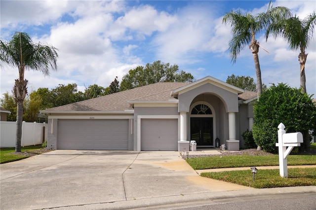 ranch-style home featuring a garage