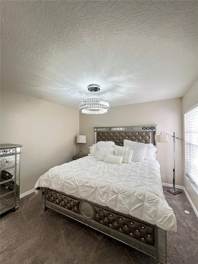 carpeted bedroom with a textured ceiling