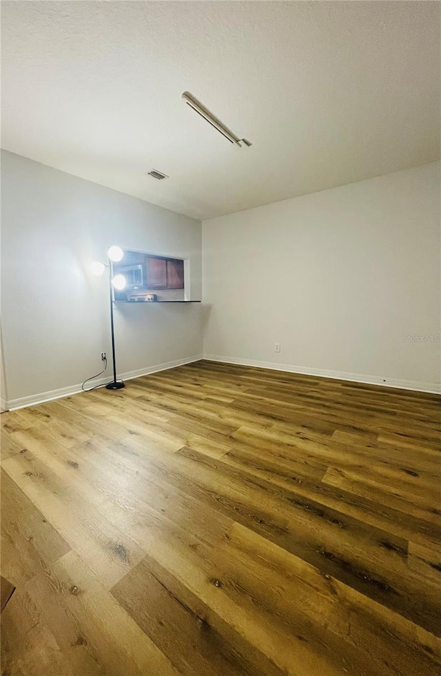 basement featuring hardwood / wood-style flooring