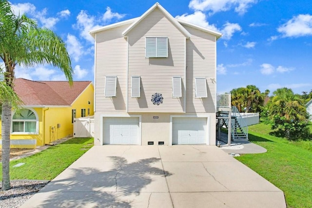 view of front of house featuring a garage and a front yard