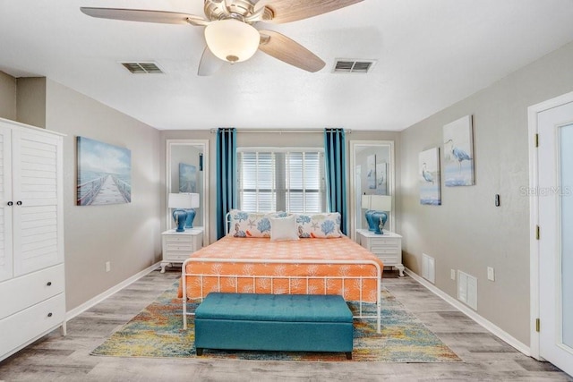 bedroom with ceiling fan and hardwood / wood-style floors