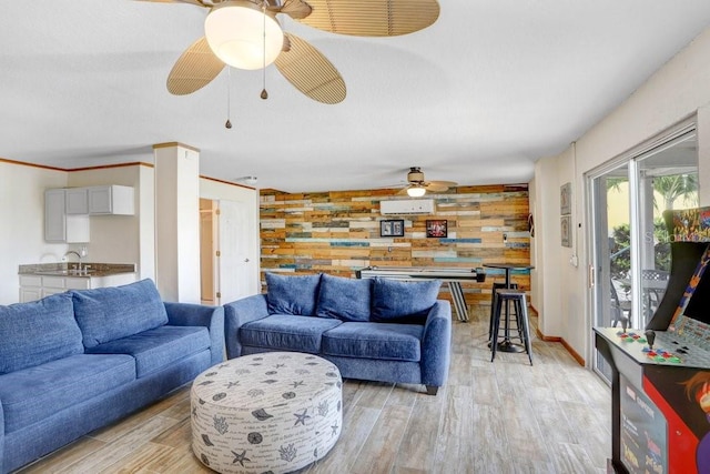 living room featuring light hardwood / wood-style floors and ceiling fan