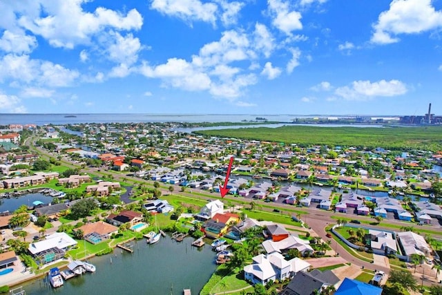 bird's eye view with a water view