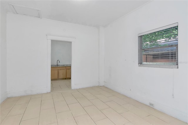 unfurnished room with sink