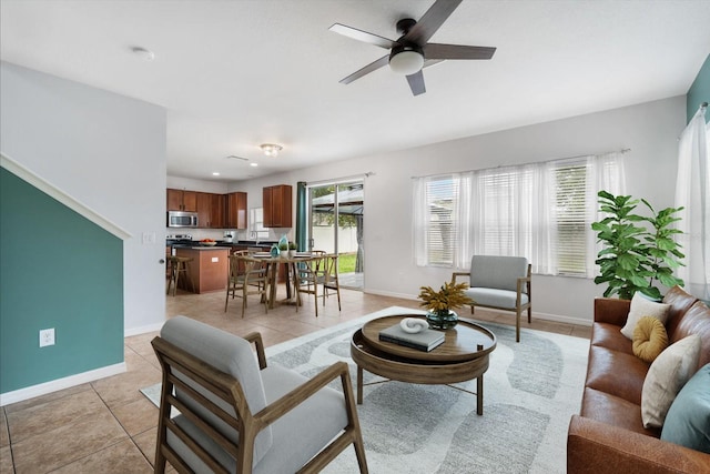 tiled living room featuring ceiling fan