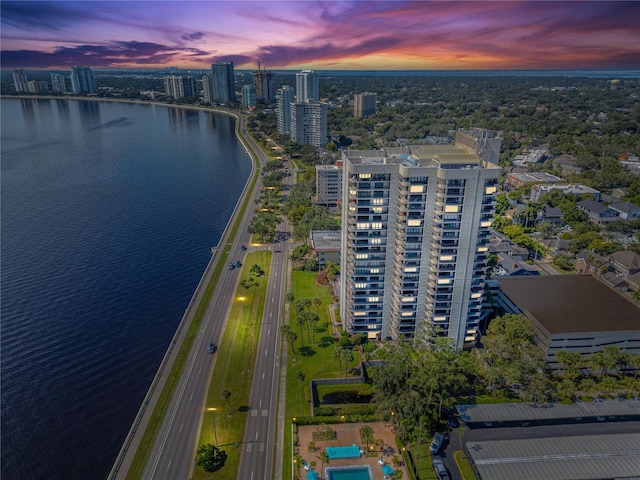 aerial view at dusk with a water view