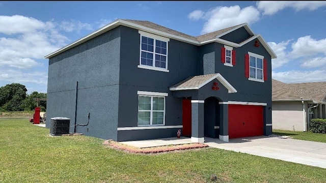 view of property with central AC unit and a front yard