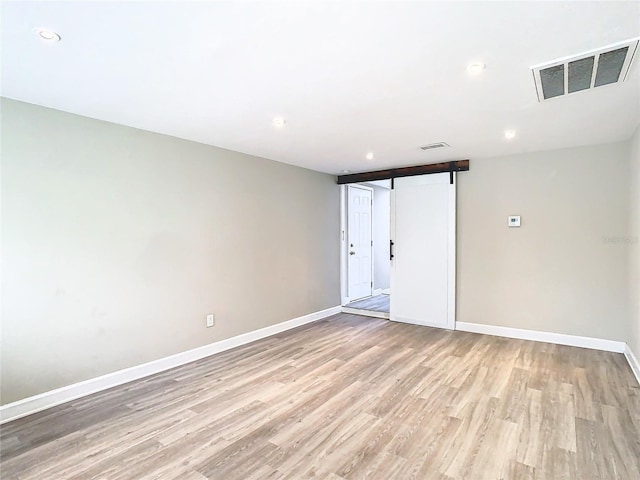 spare room featuring light wood-type flooring