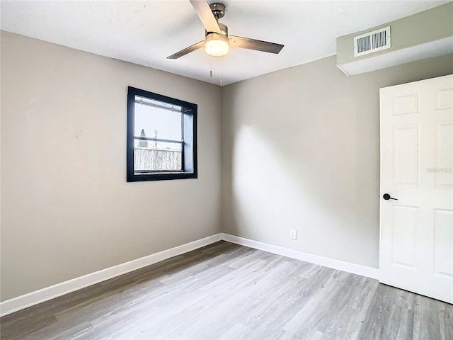 spare room with ceiling fan and hardwood / wood-style floors