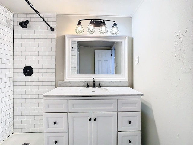 bathroom with vanity and tiled shower