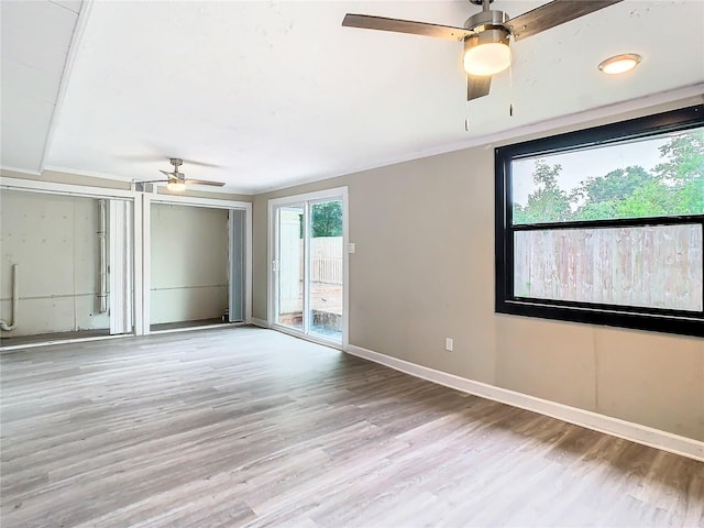 spare room with ceiling fan and light hardwood / wood-style floors