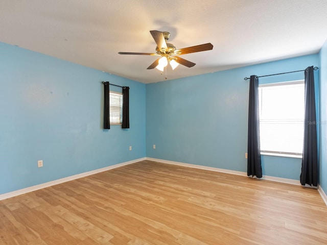 unfurnished room with ceiling fan and light hardwood / wood-style floors