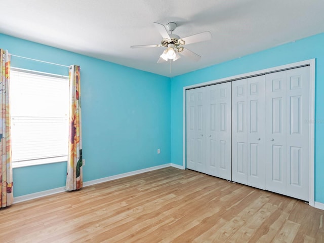 unfurnished bedroom with a closet, ceiling fan, and light hardwood / wood-style flooring