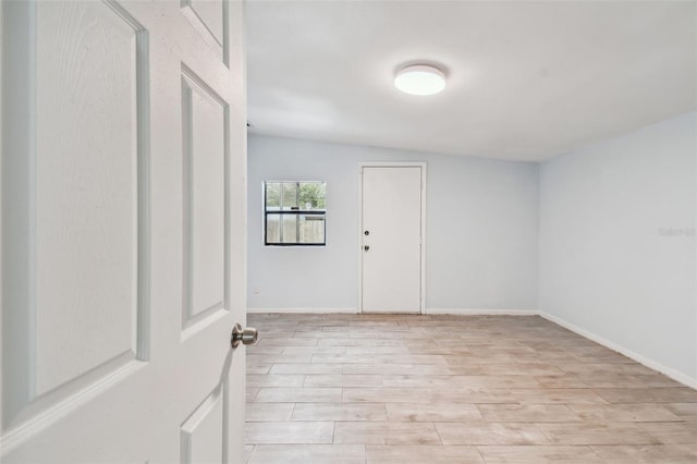 interior space featuring light hardwood / wood-style flooring and vaulted ceiling