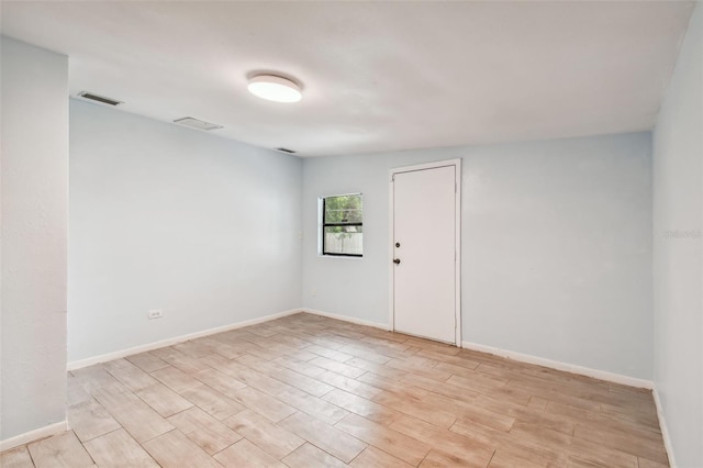 unfurnished room featuring light wood-type flooring