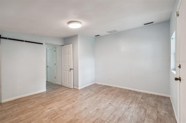 unfurnished room featuring light wood-type flooring