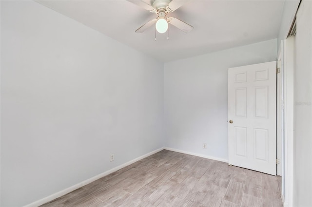 spare room featuring ceiling fan and light hardwood / wood-style flooring