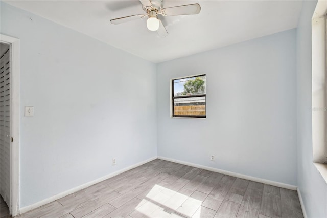 unfurnished room featuring ceiling fan and light hardwood / wood-style floors