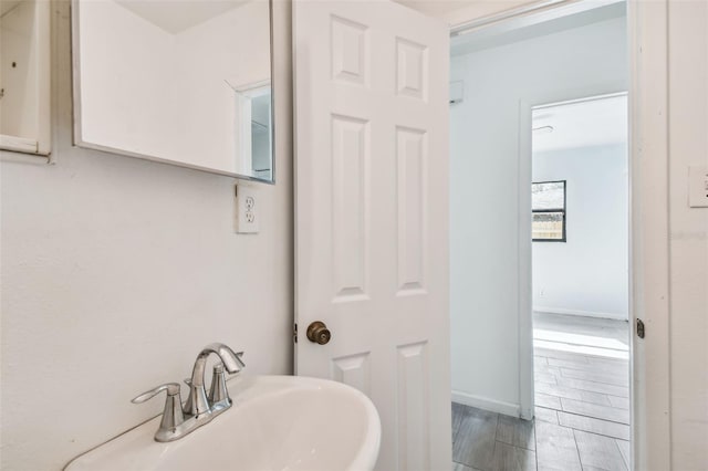 bathroom featuring hardwood / wood-style flooring and sink