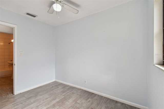 spare room with ceiling fan and light hardwood / wood-style floors