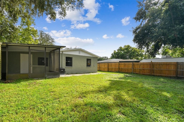 view of yard with a sunroom