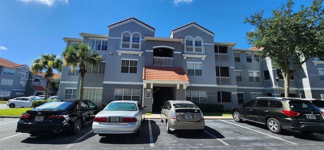 view of property with uncovered parking