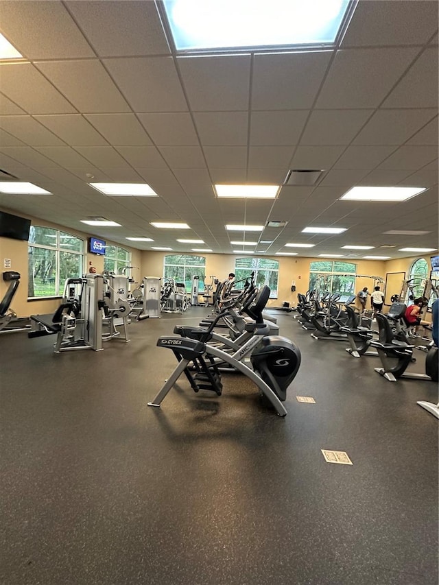 workout area featuring a drop ceiling