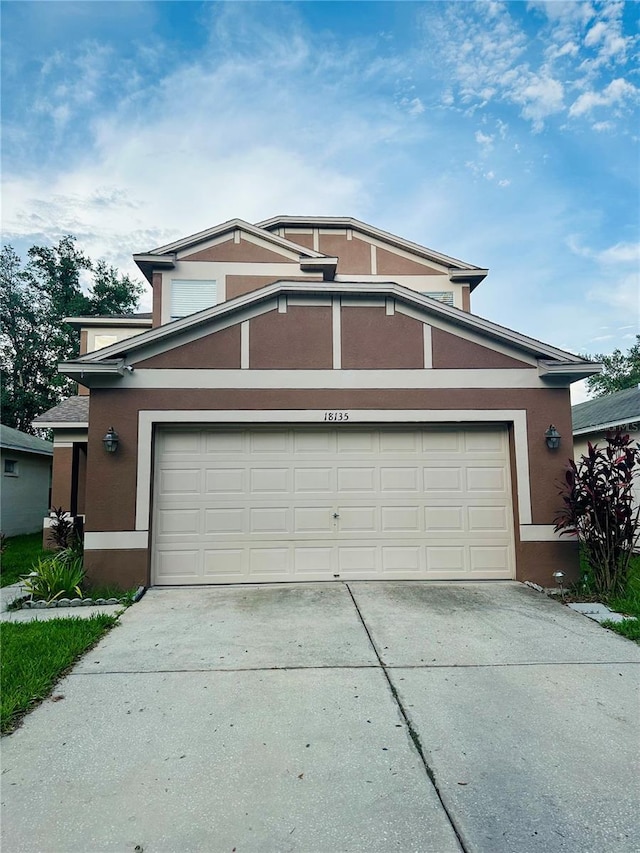 view of front of property with a garage