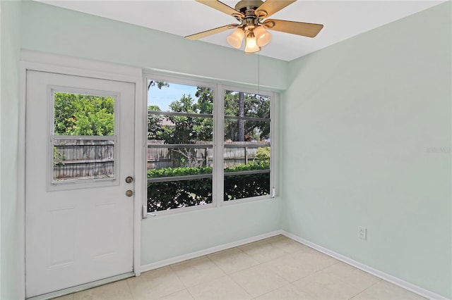 entryway featuring ceiling fan and light tile patterned flooring