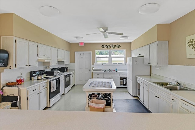 kitchen featuring sink, white appliances, ceiling fan, and white cabinets