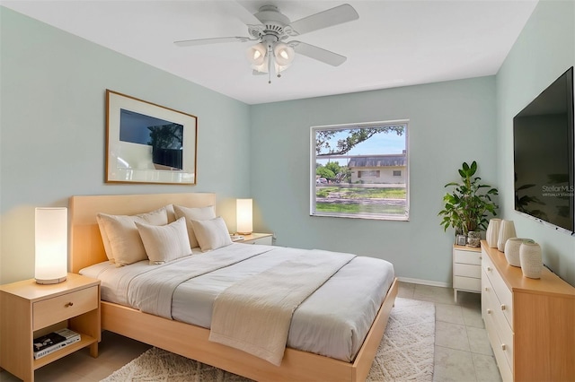 tiled bedroom with ceiling fan