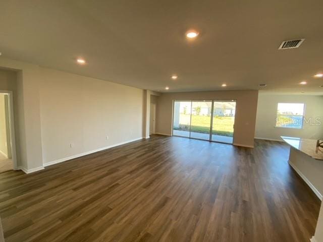 empty room with dark hardwood / wood-style floors