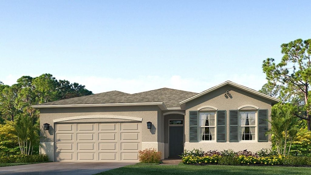 ranch-style house featuring a garage and a front yard