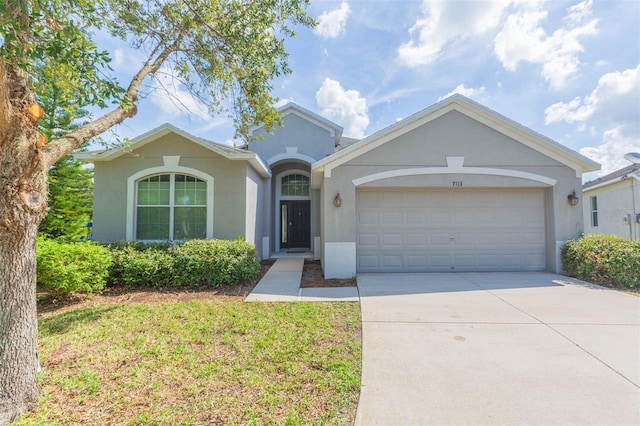 single story home featuring a garage