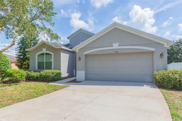 single story home featuring a garage