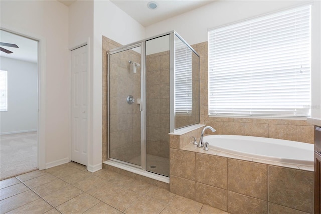 bathroom featuring ceiling fan, tile patterned floors, shower with separate bathtub, and vanity